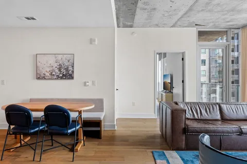 a view of a livingroom with furniture and a potted plant