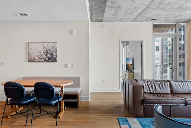 a view of a livingroom with furniture and a potted plant