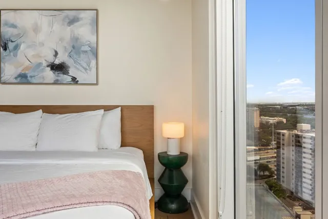 a bedroom with a bed and chair