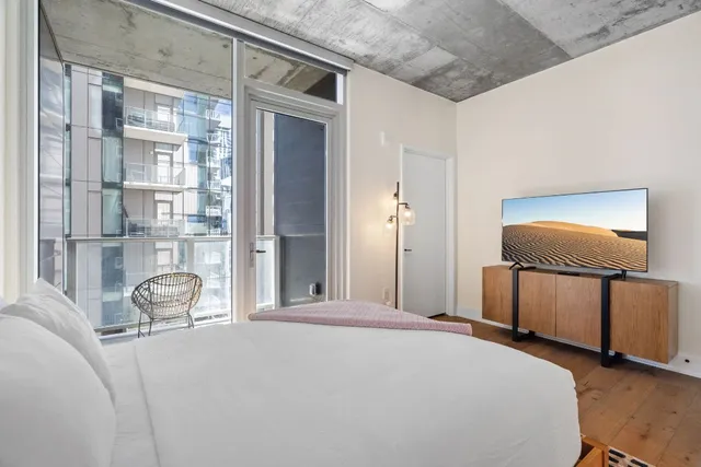 a bathroom with a double vanity sink toilet mirror and shower