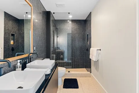 a bedroom with a large bed and a window