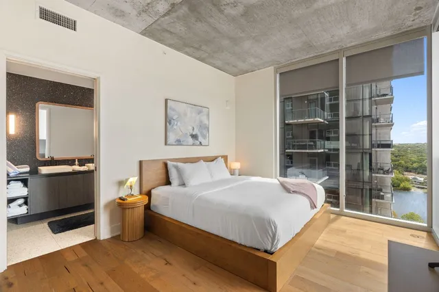 a bedroom with a bed and a window