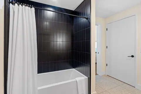 a view of a hallway with washer and dryer