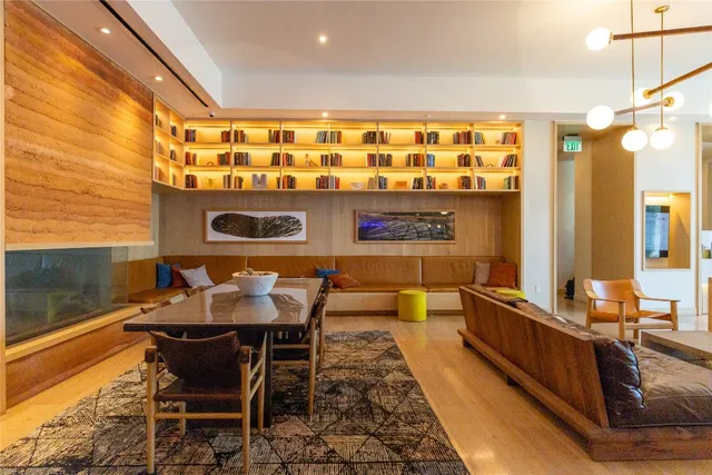 a living room with furniture and a lamp