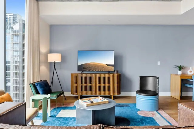 a living room with furniture and a table