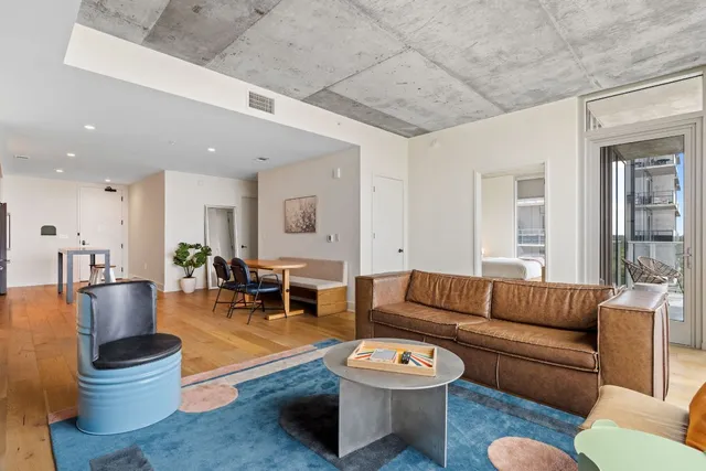 a view of a livingroom with furniture and lounge chair