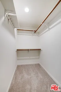 a view of a room with wooden floor and staircase