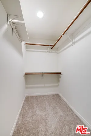 a view of a room with wooden floor and staircase