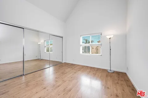 a view of an empty room with a fireplace