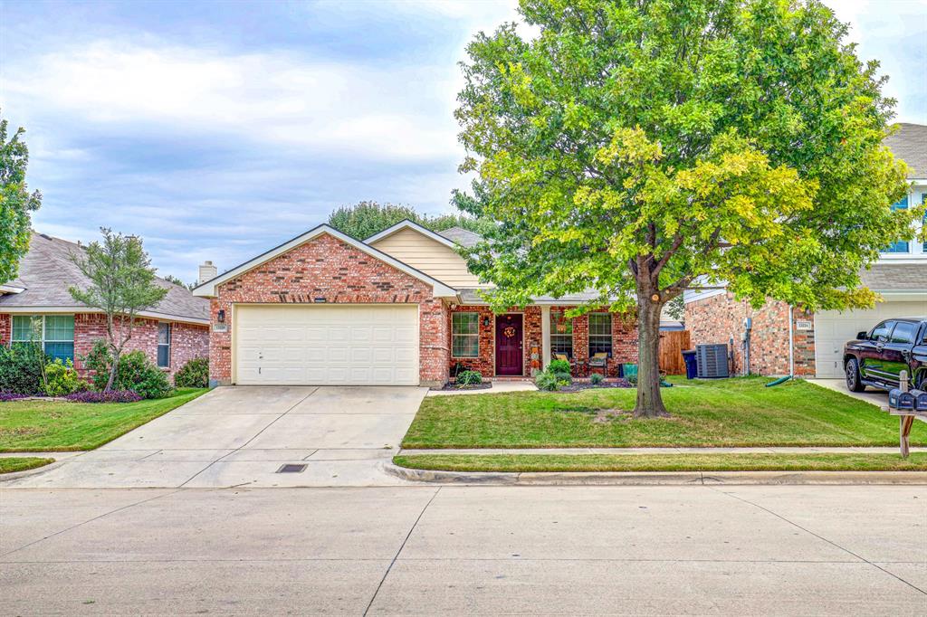 13228 Harvest Ridge Road Fort Worth, TX 76244 - Photo 1 of 1 front view of a house with a yard