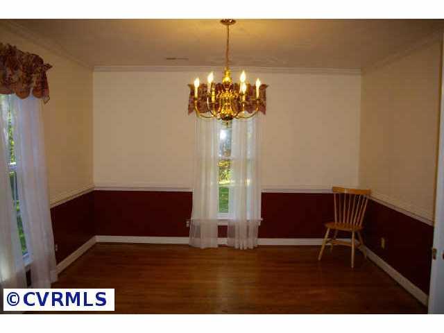 13814 Laurel Spring Road Chester, VA 23831 - Photo 7 of 8 a room with furniture and a window