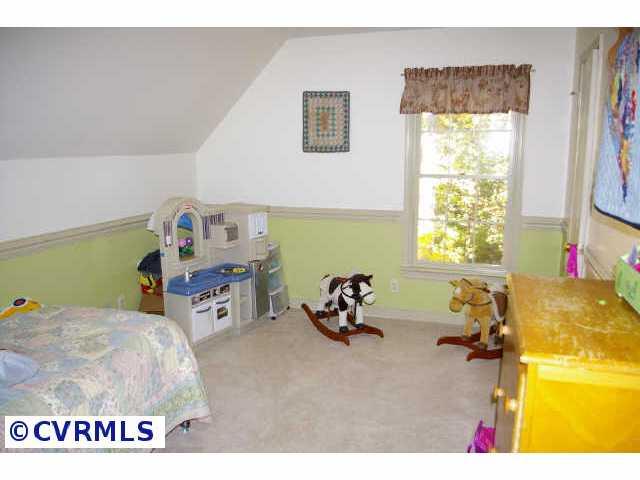 13814 Laurel Spring Road Chester, VA 23831 - Photo 8 of 8 a bed room with a bed and a window