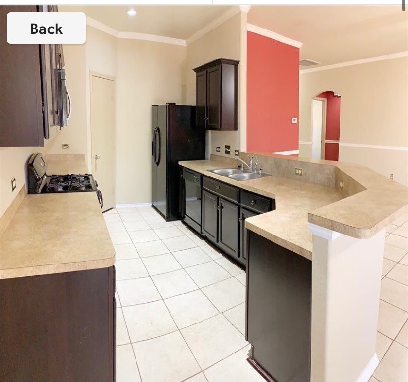5603 Sunfall Bend Lane Katy, TX 77449 - Photo 2 of 11 a kitchen with stainless steel appliances a sink stove and refrigerator