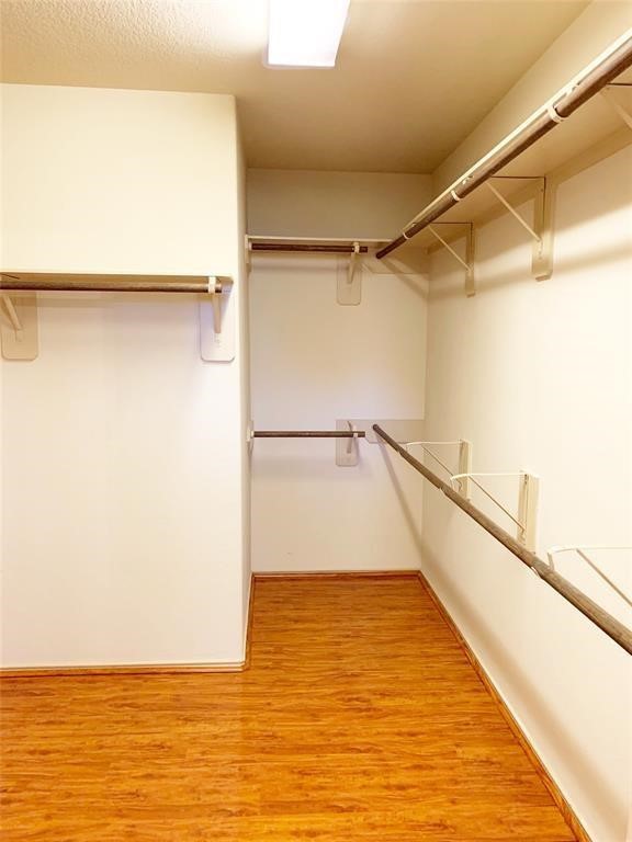 5603 Sunfall Bend Lane Katy, TX 77449 - Photo 5 of 11 a view of walk in closet with empty racks