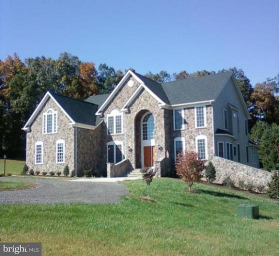 19930 Gunpowder Road Manchester, MD 21102 - Photo 1 of 30 a front view of a house with a garden and plants