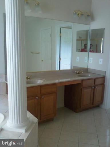 19930 Gunpowder Road Manchester, MD 21102 - Photo 19 of 30 a view of cabinets a sink and a window