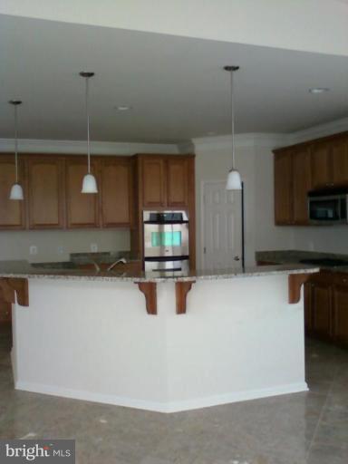 19930 Gunpowder Road Manchester, MD 21102 - Photo 8 of 30 a kitchen with stainless steel appliances granite countertop a sink a stove and a microwave oven