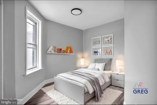 a bedroom with a bed and a window