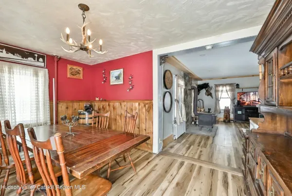 a view of a dining room with furniture window and outside view