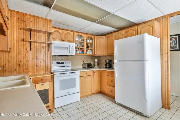 a kitchen with stainless steel appliances granite countertop a stove and a refrigerator