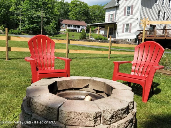 a view of a backyard with plants and a patio