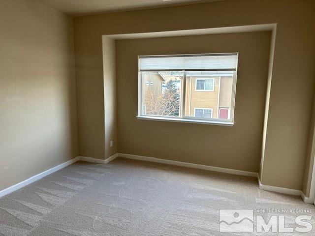 4628 Kathleen Denise Lane Reno, NV 89503 - Photo 4 of 13 an empty room with windows