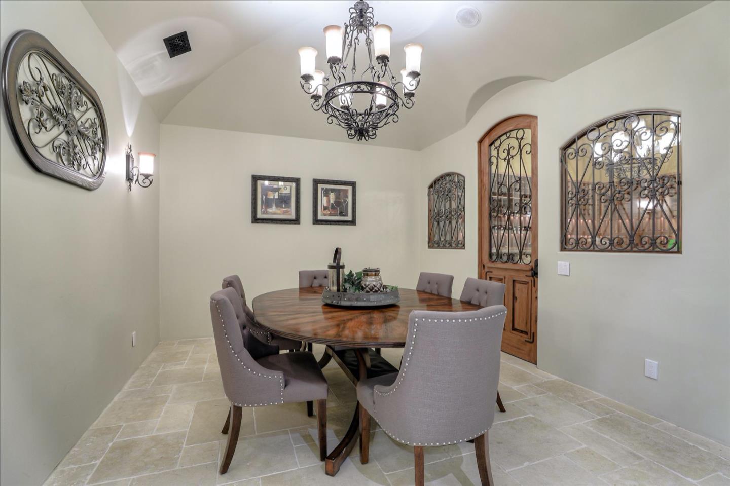 247 Atherton Avenue Atherton, CA 94027 - Photo 6 of 8 a dining room with furniture and a chandelier