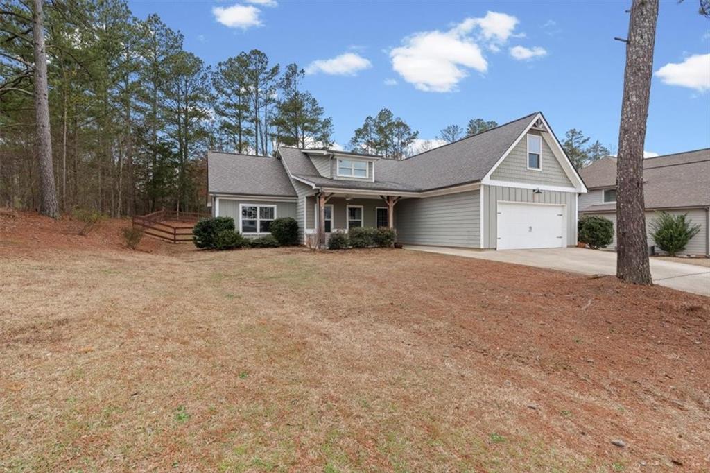19 Stonegate Court Dallas, GA 30157 - Photo 1 of 1 a front view of a house with a yard and garage