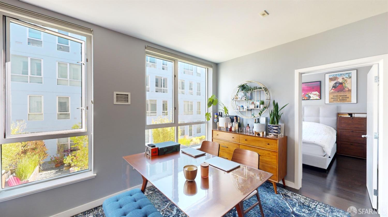 888 7th Street, Unit 234 San Francisco, CA 94107 - Photo 2 of 10 a living room with furniture and a table