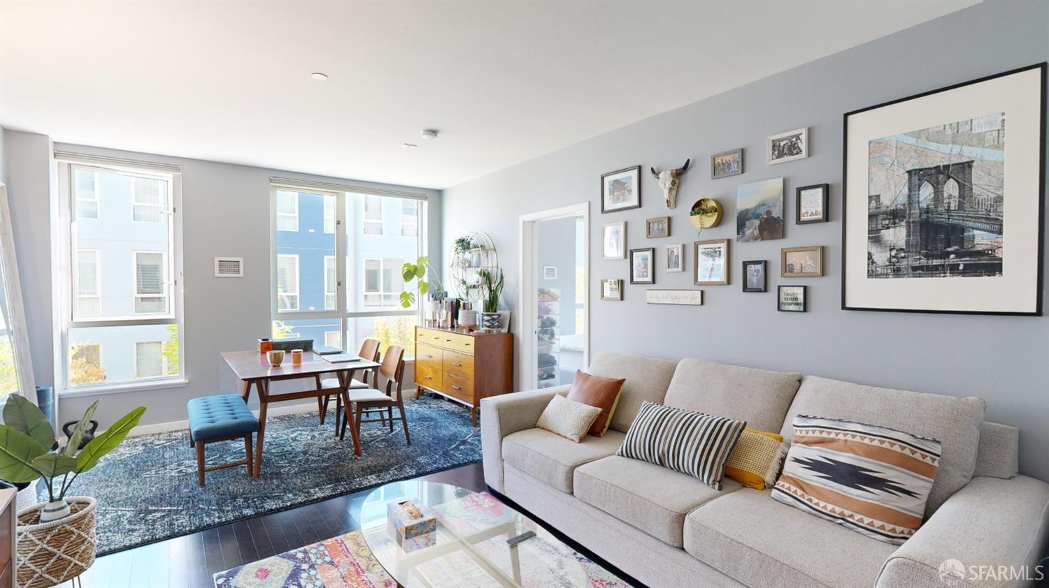 888 7th Street, Unit 234 San Francisco, CA 94107 - Photo 3 of 10 a living room with furniture and painting on the wall