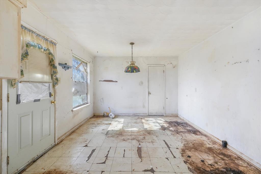 12924 Mitchell Drive Balch Springs, TX 75180 - Photo 5 of 14 a view of a hallway with closet and wooden floor