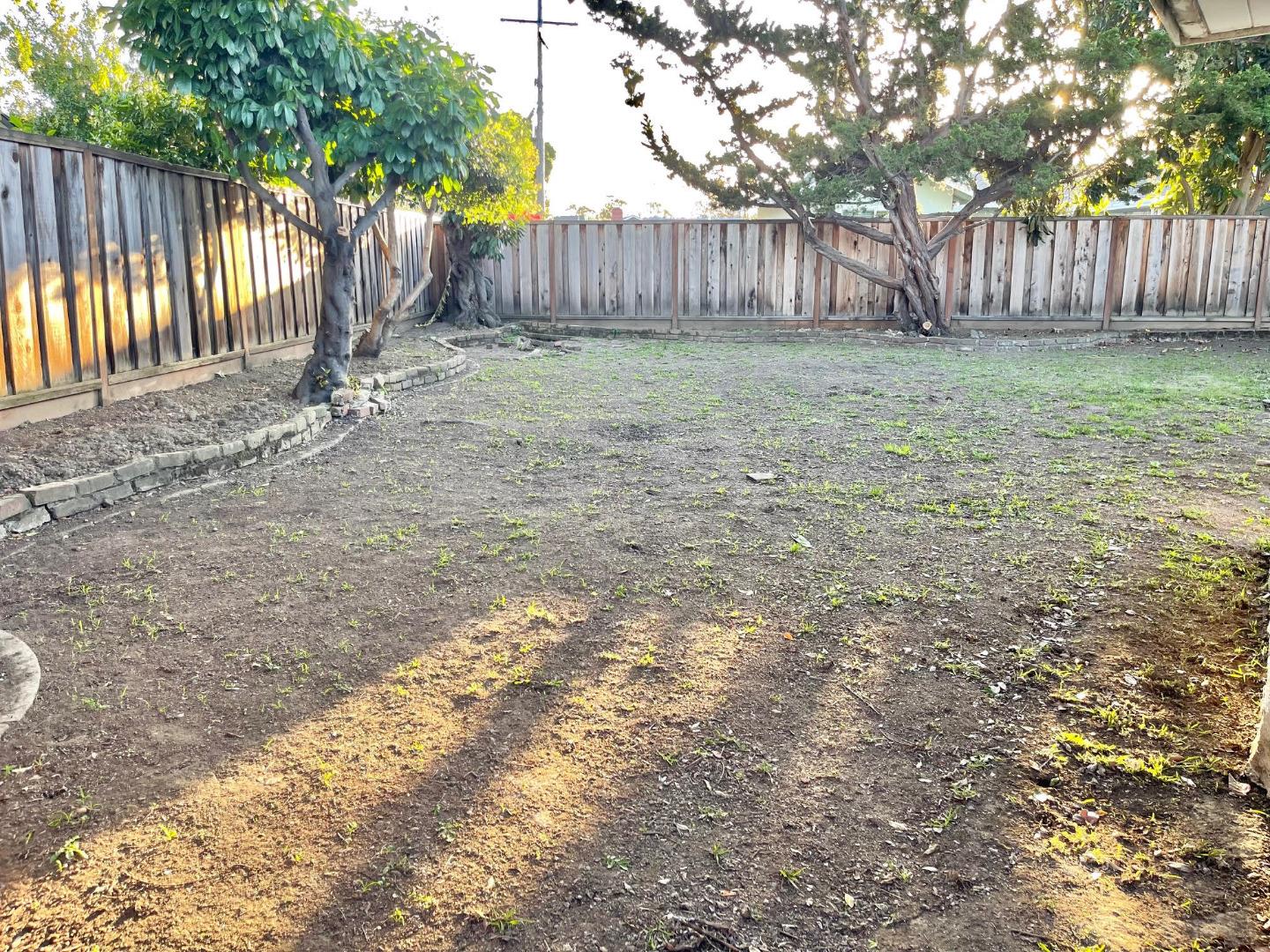 1222 Morningside Drive Sunnyvale, CA 94087 - Photo 24 of 34 a backyard of a house with trees and wooden fence