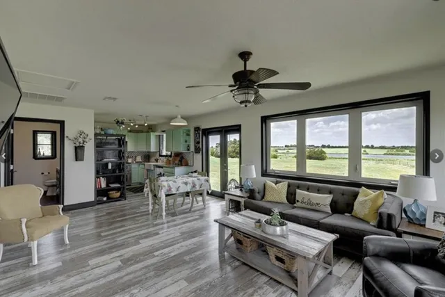 a living room with furniture and a large window