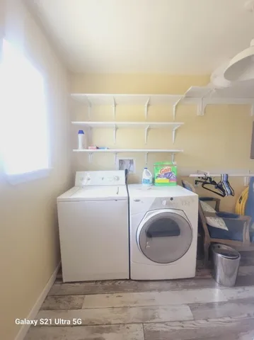 a utility room with dryer and washer