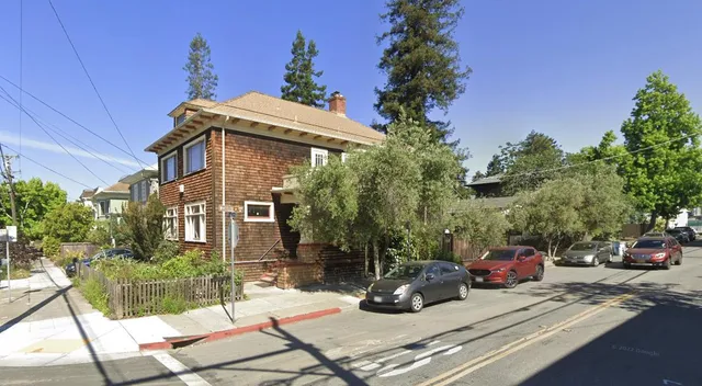 a view of a car park in front of house
