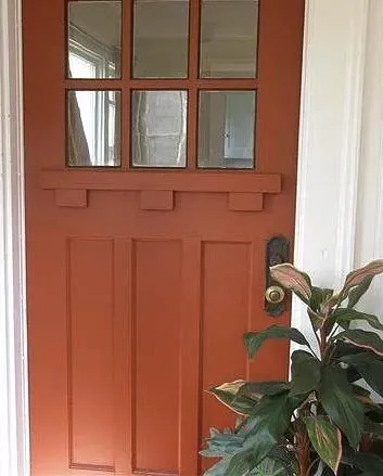 a view of a workspace room with wooden floor and windows