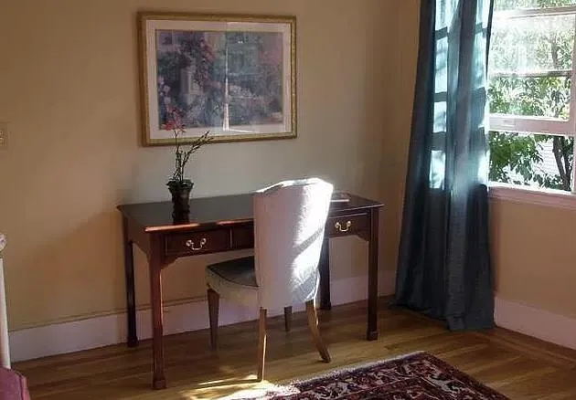 a view of a door and chair in a room