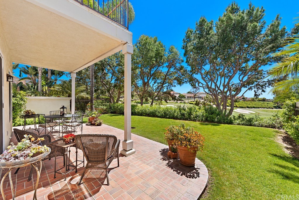 14 Marquesa Dana Point, CA 92629 - Photo 6 of 6 a view of a patio with a table chairs and a garden
