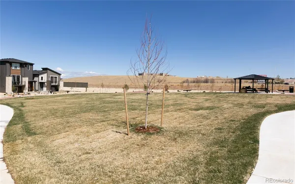 a view of a house with backyard porch and sitting area