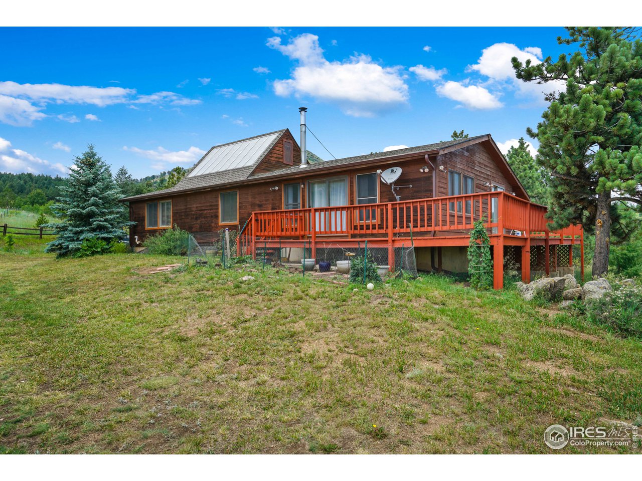 4147 Sugarloaf Road Boulder, CO 80302 - Photo 33 of 38 a view of a house with a yard balcony and sitting area