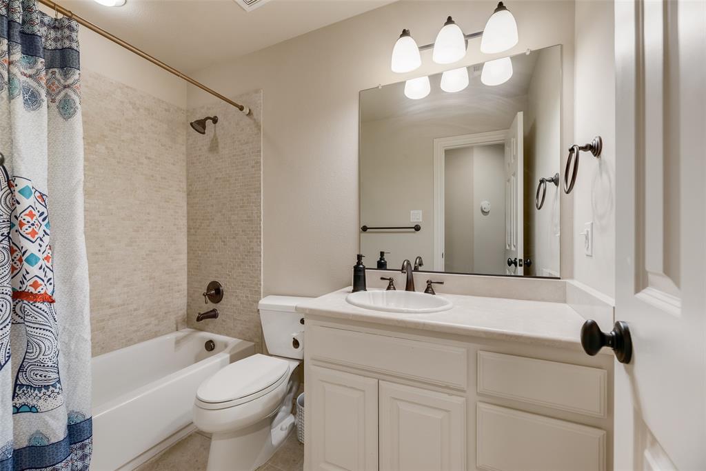 1909 Rising Star Drive Allen, TX 75013 - Photo 11 of 26 Bathroom with vanity and shower / bathtub combination with curtain