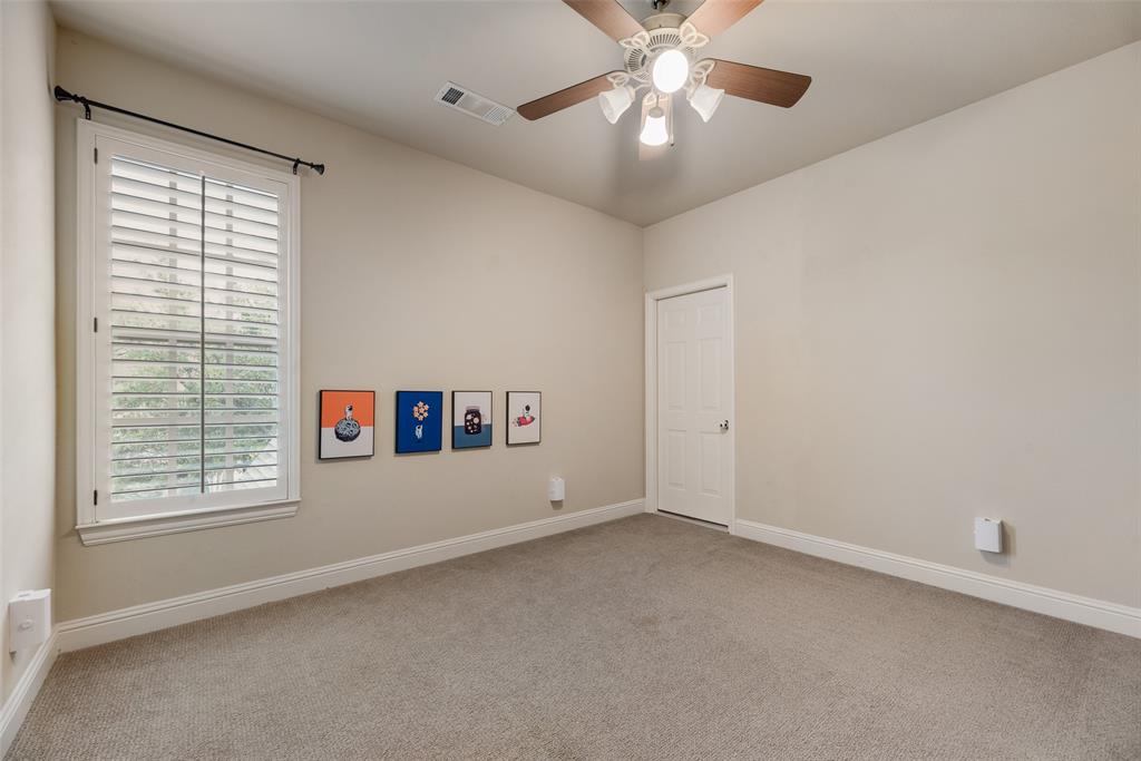 1909 Rising Star Drive Allen, TX 75013 - Photo 12 of 26 Carpeted spare room with baseboards and ceiling fan