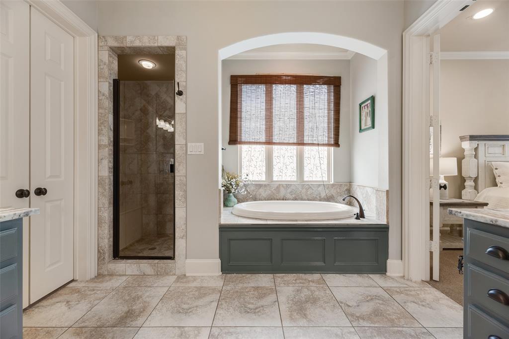 1909 Rising Star Drive Allen, TX 75013 - Photo 17 of 26 Full bathroom featuring vanity, a stall shower, ornamental molding, and a garden tub