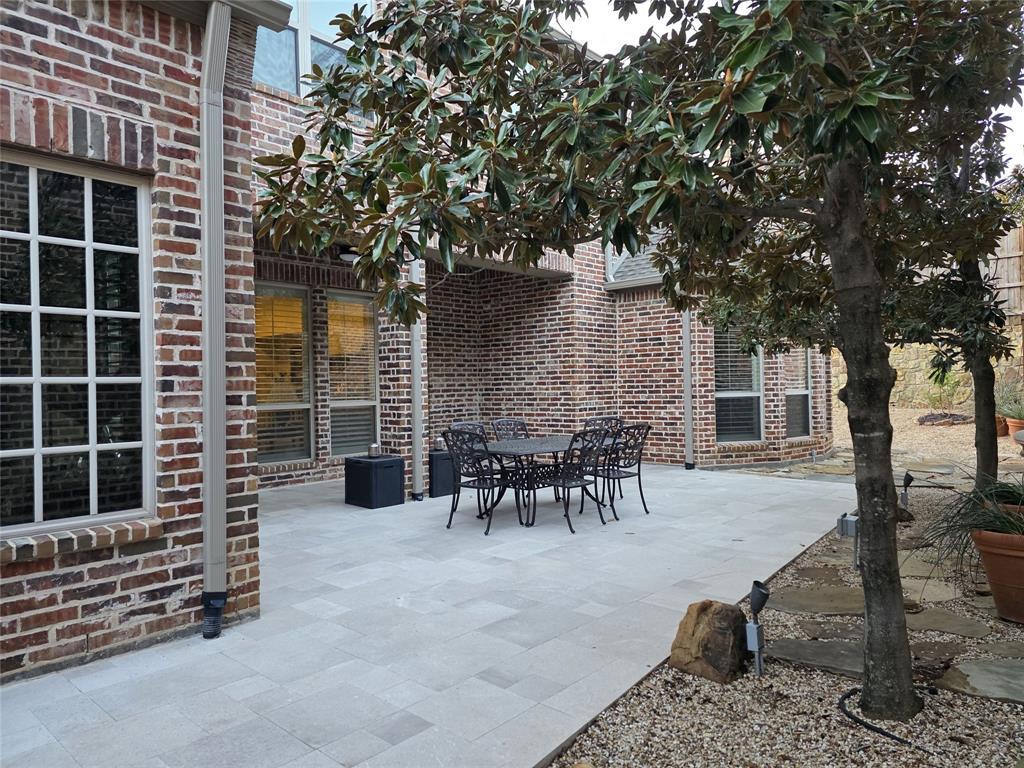 1909 Rising Star Drive Allen, TX 75013 - Photo 21 of 26 View of patio with outdoor dining area