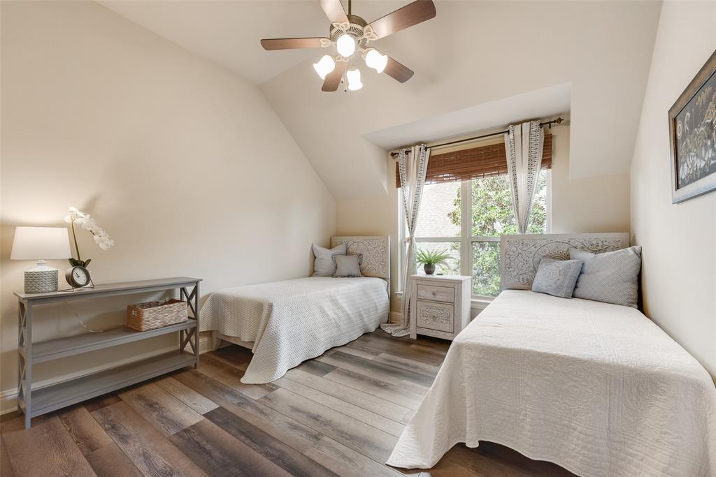 1909 Rising Star Drive Allen, TX 75013 - Photo 7 of 26 Bedroom featuring vaulted ceiling, a ceiling fan, and wood finished floors