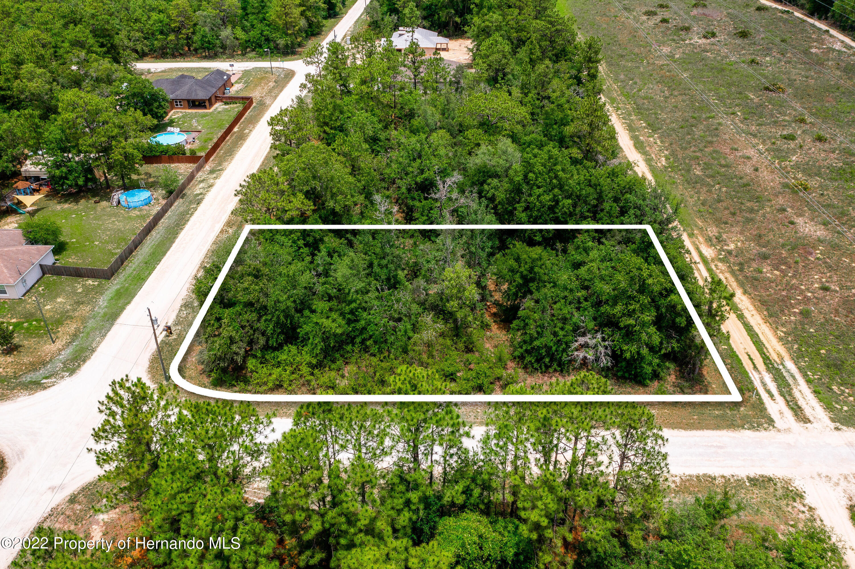 13500 Downy Woodpecker Road Weeki Wachee, FL 34614 - Photo 17 of 28 a view of a yard with staircase