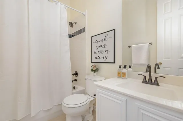 a bedroom with a bed and a desk