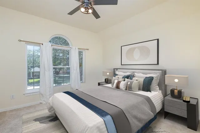 a bathroom with a bathtub sink and a mirror