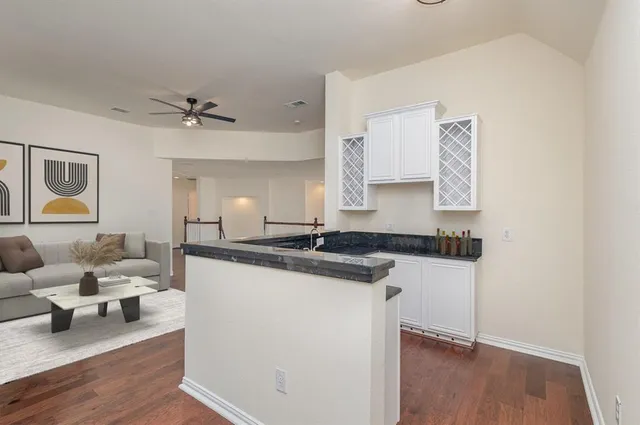 a bedroom with a bed and ceiling fan