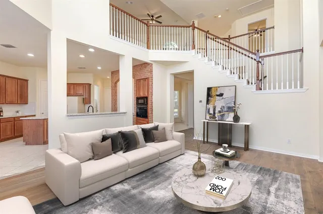 a living room with furniture and a table